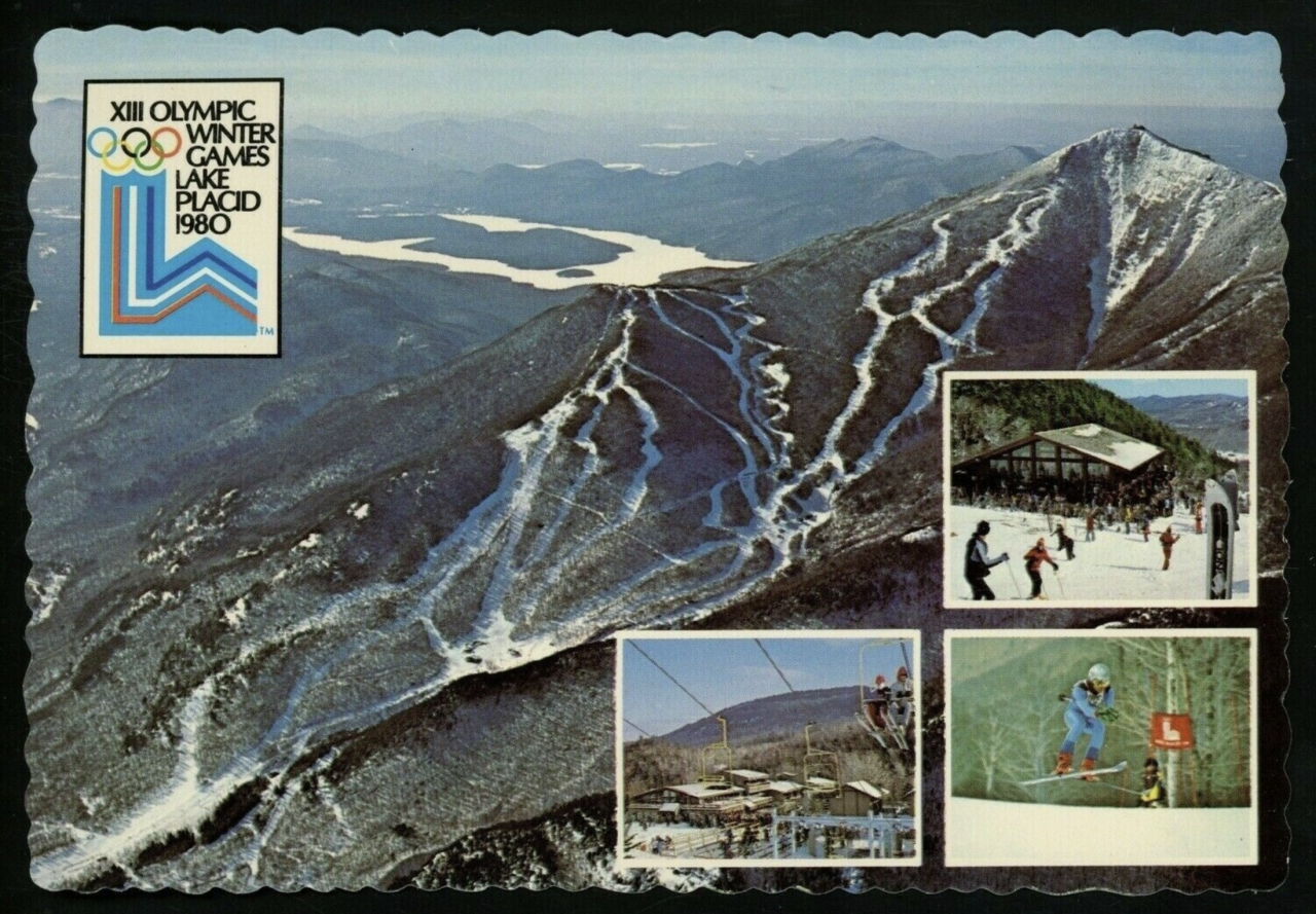 A vintage postcard shows an aerial image of Whiteface Mountain, along with smaller images from the mountain and the logo of the 1980 Lake Placid Olympics.